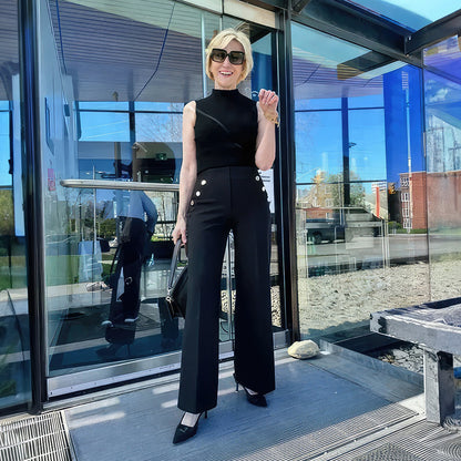 Byxor med vida ben med knapp för mage